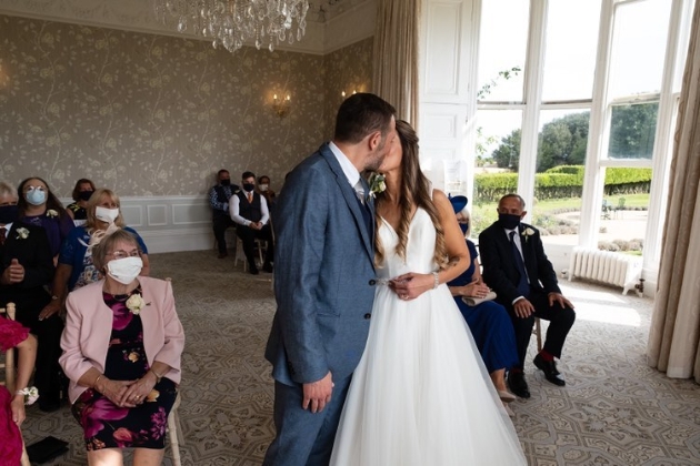 bride and groom at altar