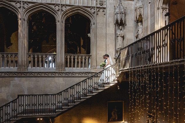 Bride walks down grand staircase