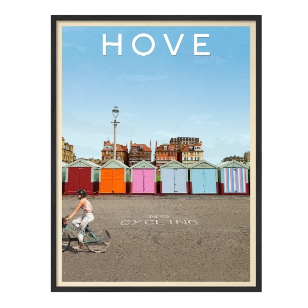 beach huts on sea front with cyclist in front