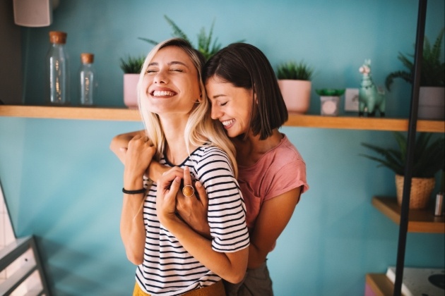 couple hugging in own home 