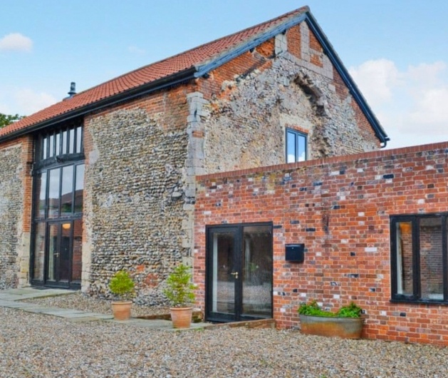 brick barn conversion with panoramic windows 