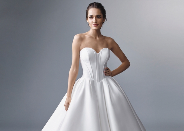 model wearing strapless gown in duchess satin