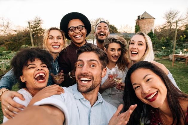 group of guys and girls taking a selfie