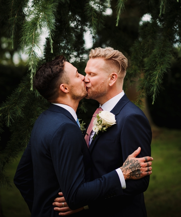 Grooms kissing