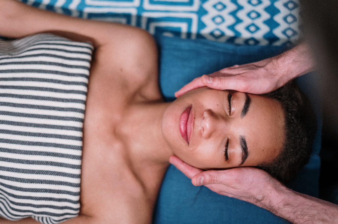 woman laying down having a facial