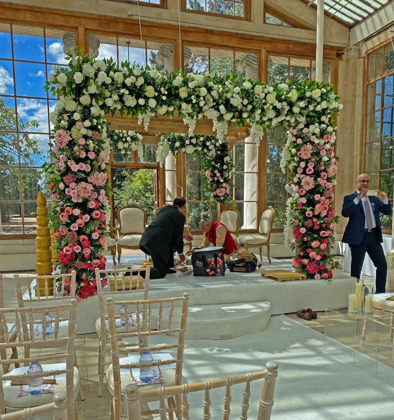 floral arch in a glass conservatory