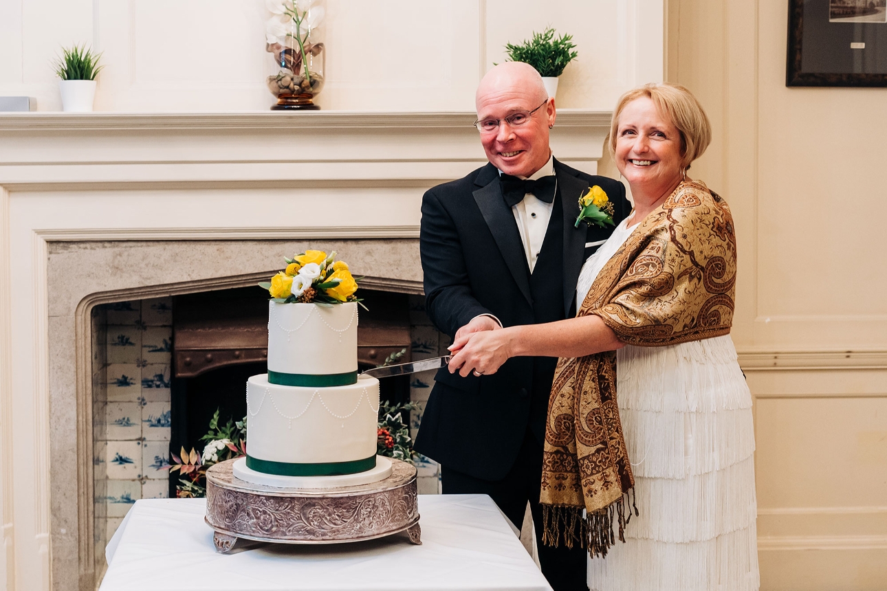 Bride and groom cut the cake