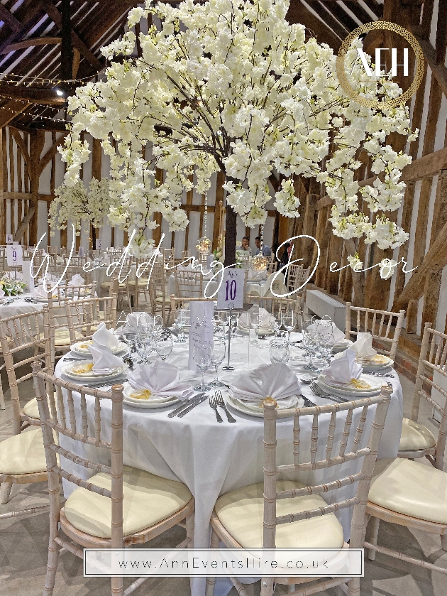blossom trees at reception of barn wedding venue