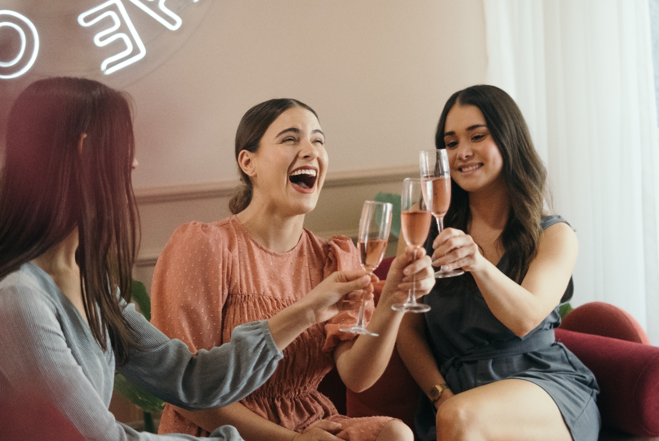 three women drinking pink prosecco