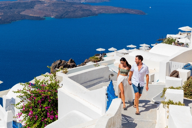 Couple walking through the streets of Santorini