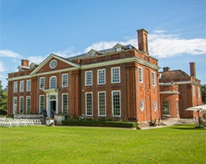 manor house redbrick white details sunny day