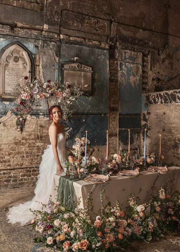 model on a shoot in a warehouse with lots of forla displays