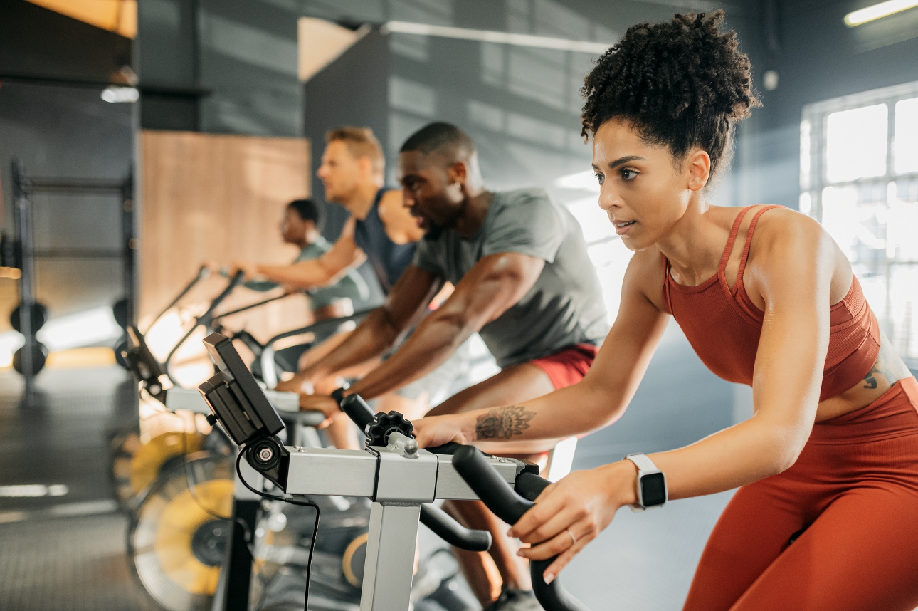 group of people on spin bike in a gym