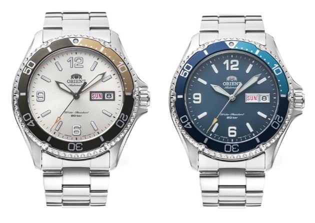 Two watches, one with a white face and the other with a blue face