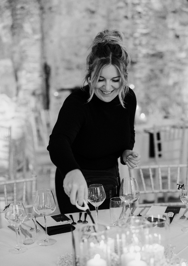 georgie light a candle on a dress wedding table