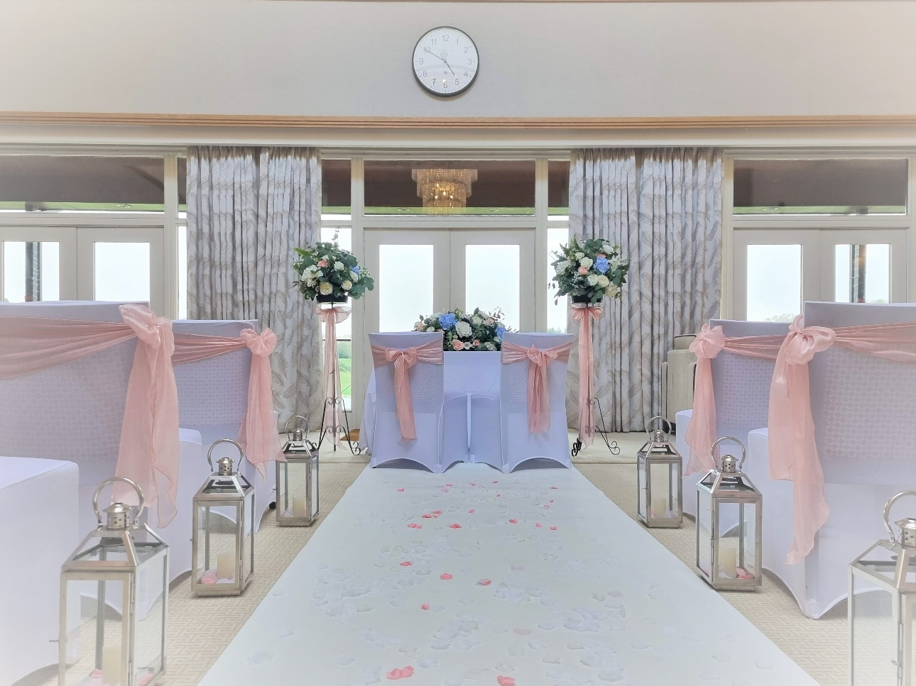 Bearwood Lakes ceremony room white with white chairs and pink sashes