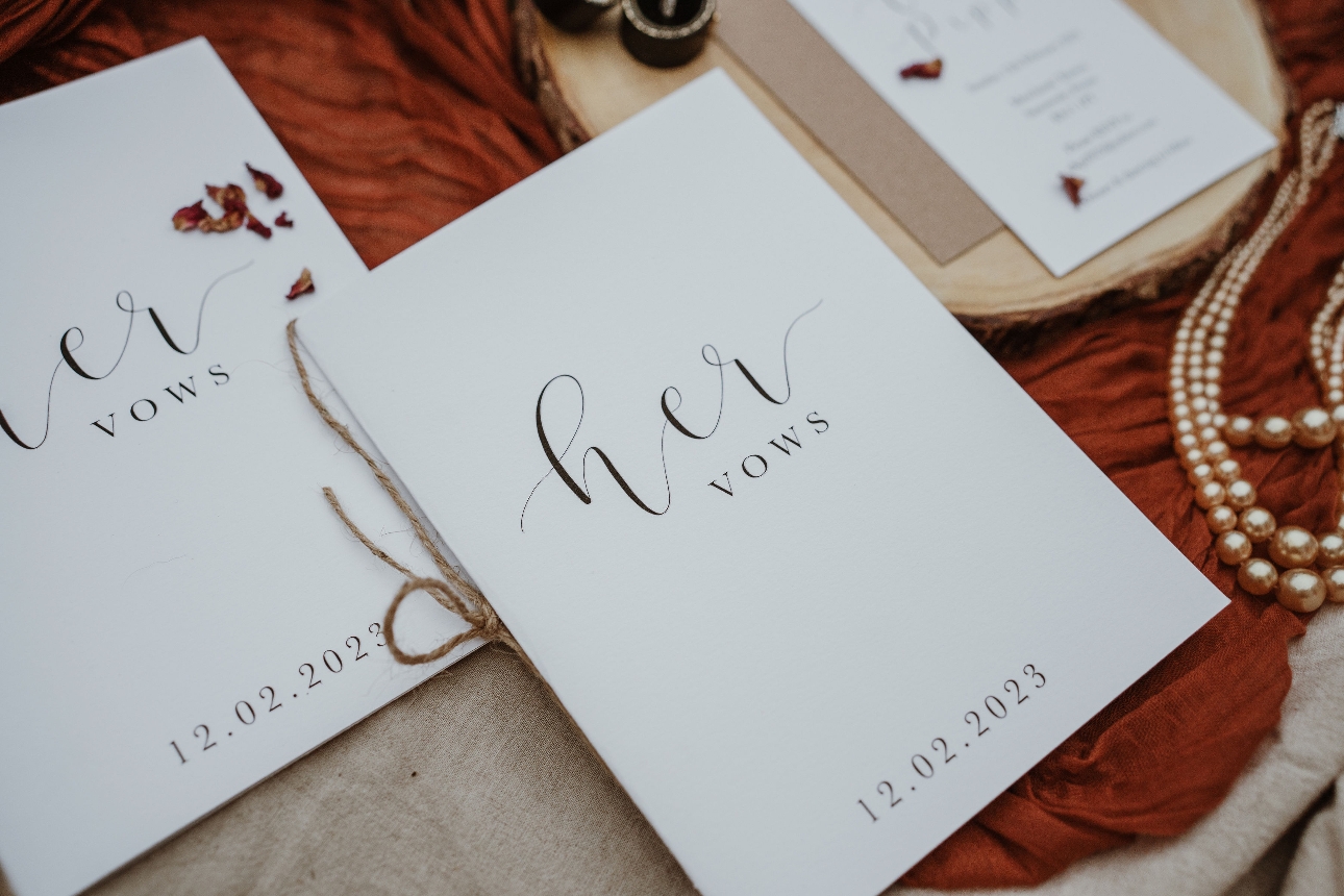 white vow booklets with the letters vow written on it