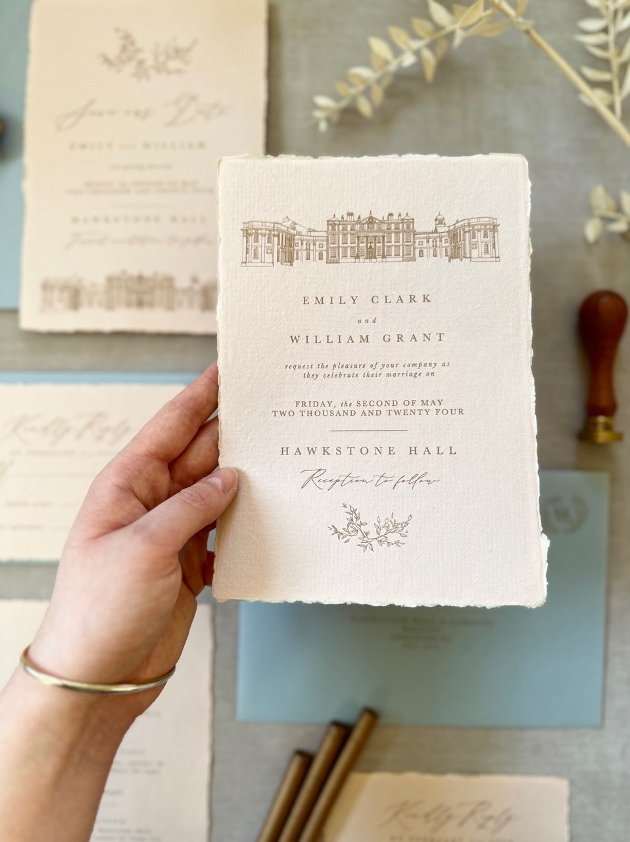 cream invite with gold venue image and rough edges 