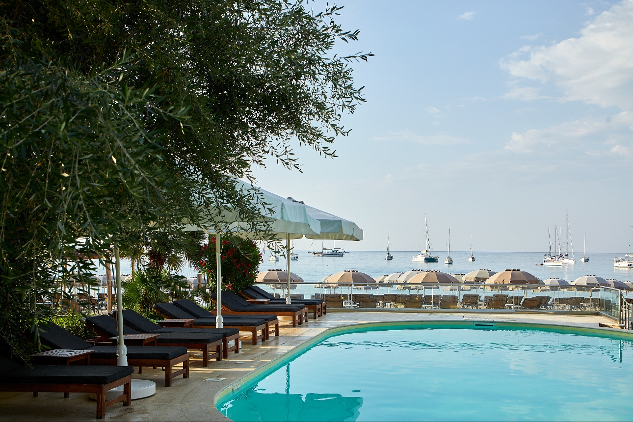 poolside with sun loungers and sea views