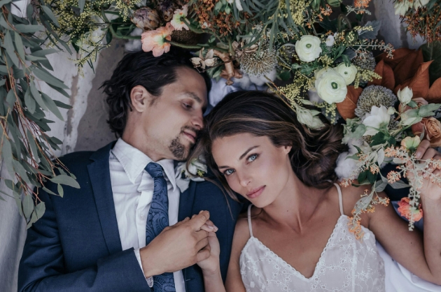 bride in dress with pink flowers