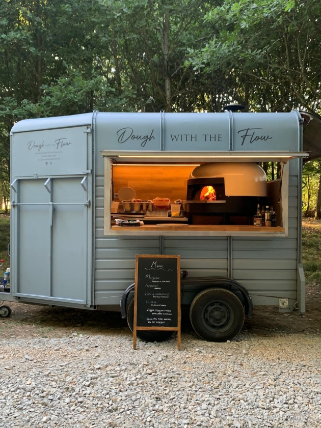 Dough with the Flow family-run catering team serving Italian-style sourdough pizzas at a wedding
