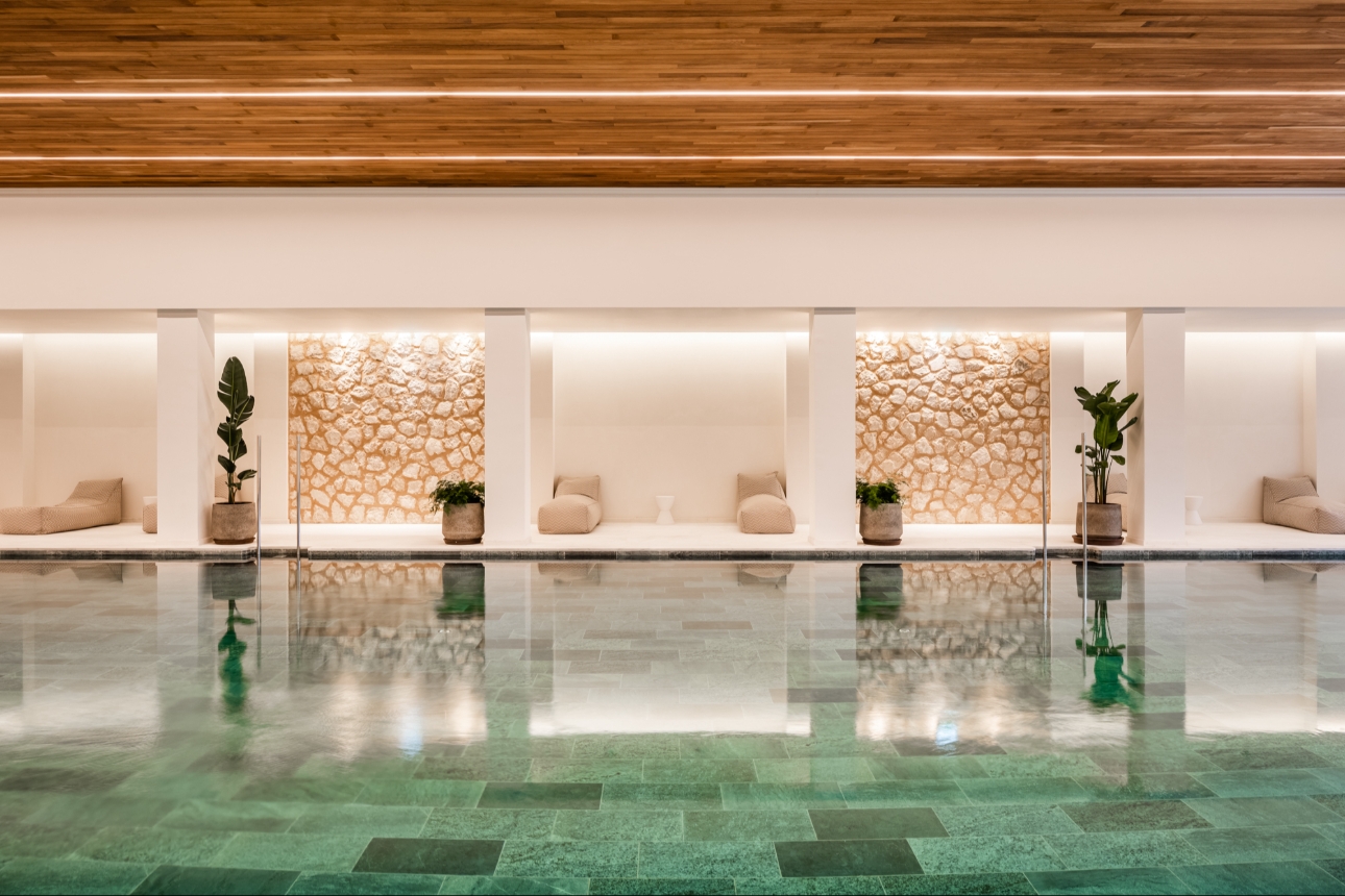 tranquil indoor pool with spa style decor