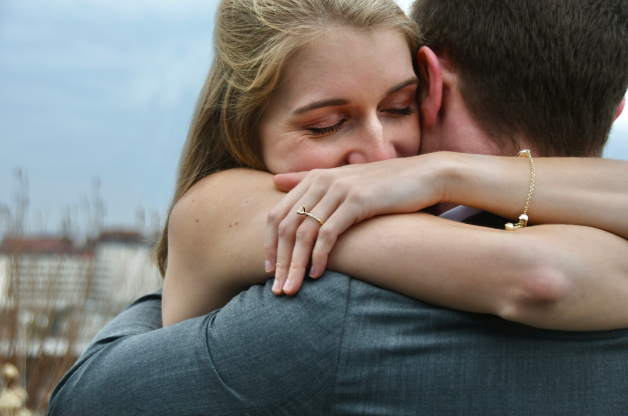 couple embracing after getting engaged