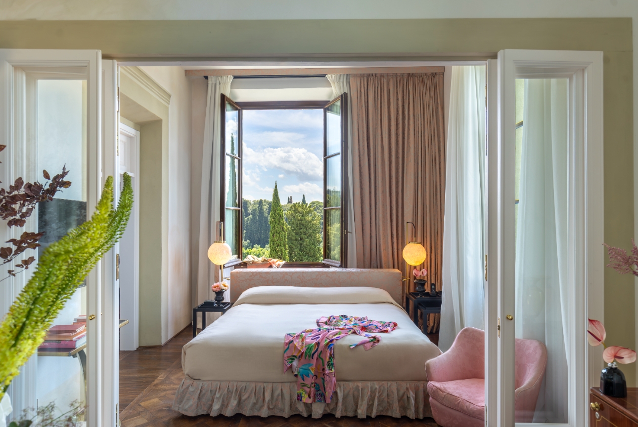 italian in style bedroom looking out to hillside