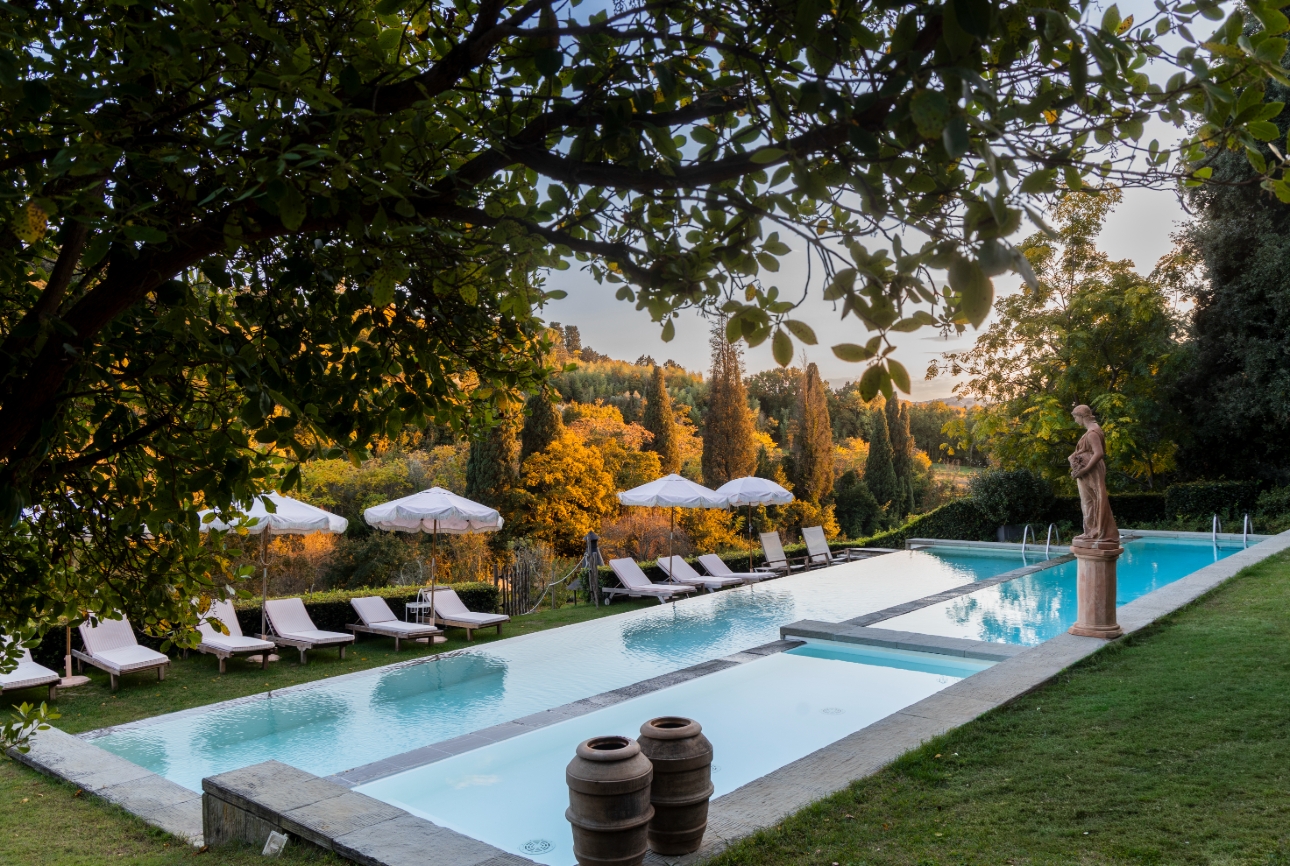 swimming pool with hillside views